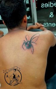 spider tattoo on back black widow
