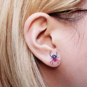 spider tattoo on ear