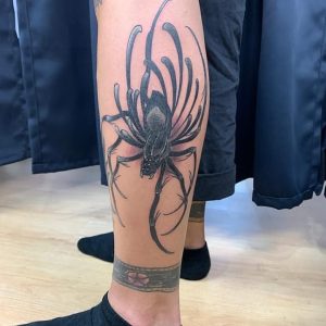 spider tattoo on leg
